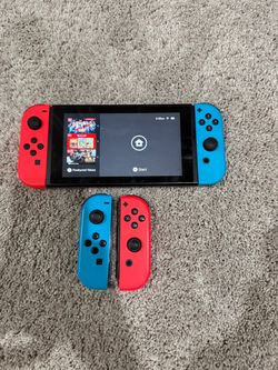 Nintendo Switch with  Red + Blue Joy-Cons