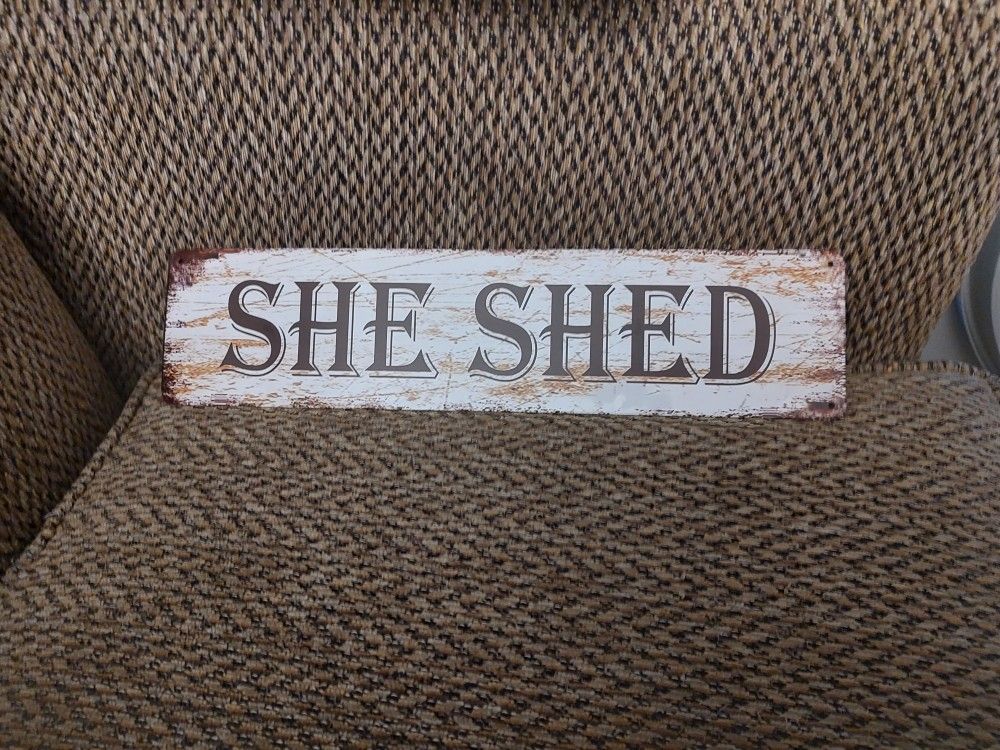 SHE SHED METAL SIGN. 16" X 4". NEW. PICKUP ONLY.