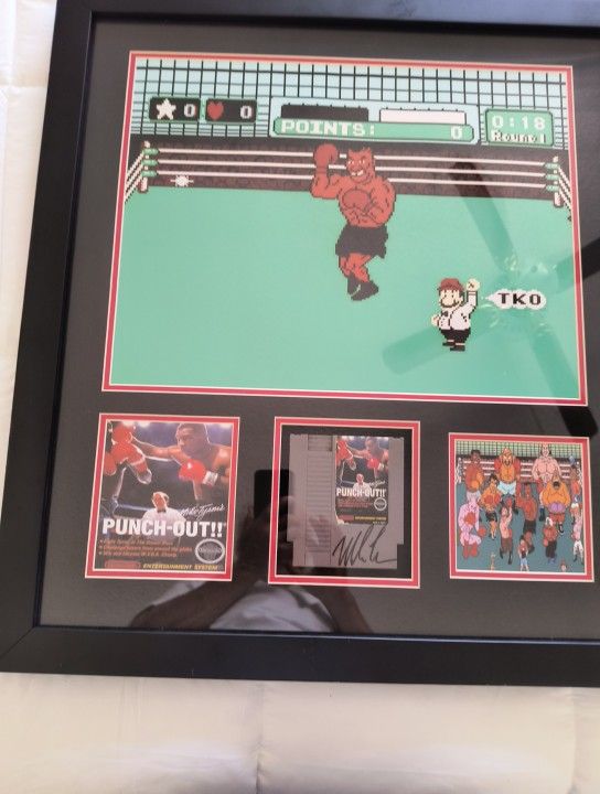 A Mike Tyson Signed Picture With Gloves And Nintendo Game