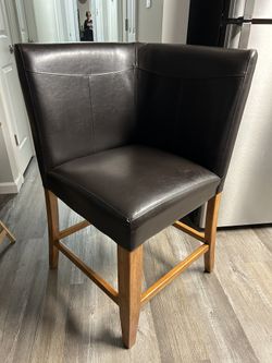 Brown leather corner chair. (bar Height)