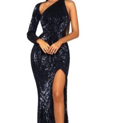 Portia and Scarlett Design One shoulder long sleeves gown. The mermaid fit of the dress and the sequin fabric makes the dress very flattering on the