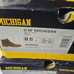 Wolverine work boots both size 8.5 and have U of M emblem on them one pair are blue and the other brown.