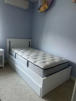 Free IKEA twin sized bed frame and beauty rest mattress
