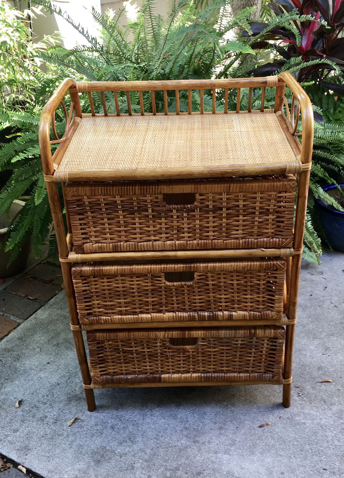 Small brown wicker dresser with shelf