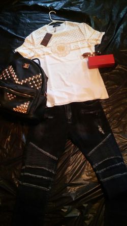 Balmain jeans, w/ shirt, backpack, & glasses