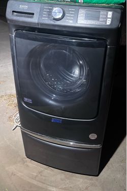 This machine is a Maytag Pet Pro System Front Load Washer (Model: MFW7020RF) in Midnight Steel.
