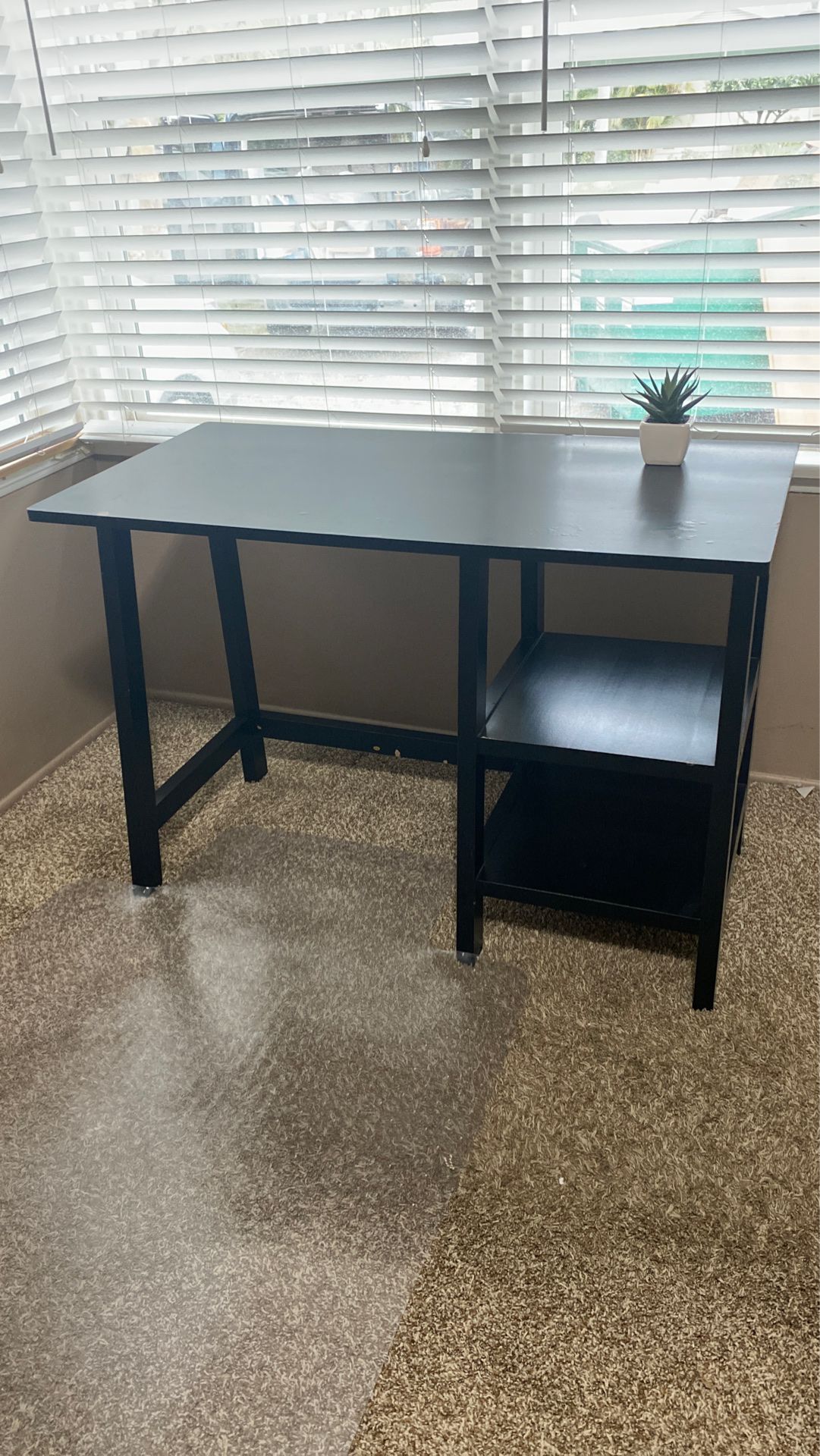Office desk and clear carpet chair mat