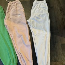Three pairs of Nike fleece sweatpants size men’s medium
