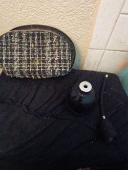 Bathroom bag and broken perfume bottle with puffer