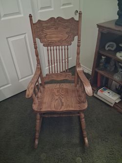 Have a nice oak rocking chair adult size