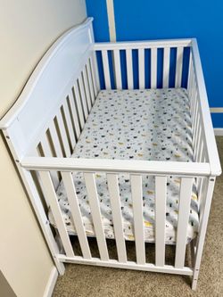 4-in-1 convertible baby crib with mattress