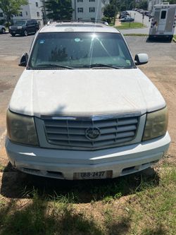 Cadillac escalade 2002 y Kia sedona 2008