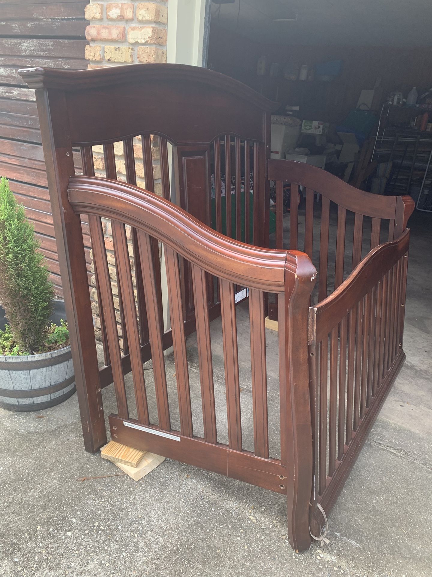 Baby bed with spring and mattress. Turns into toddler bed and full-size headboard
