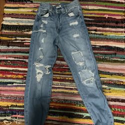 High-waisted, straight-leg distressed denim jeans #distresseddenim #baggyjeans #vintage 