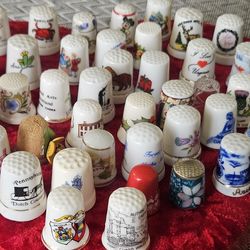 collection of porcelain and ceramic souvenir thimbles