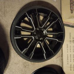 Four 24 Inch Rims w tires