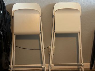 2 White hard chairs