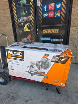 RIDGID CORDED 12"IN SLIDING MITER SAW  has small dent