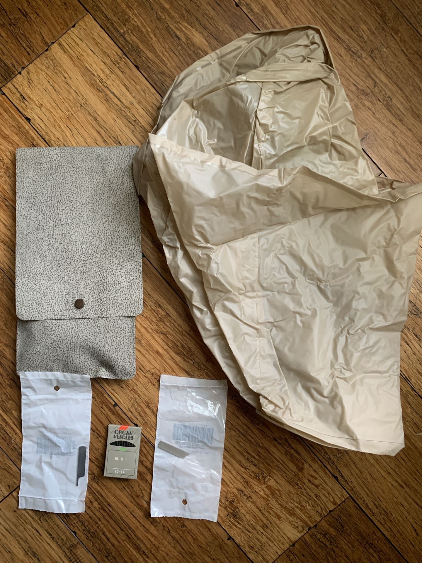 Extra parts, cover, needles for serger   by Bernette by Bernina. Should work with other brands.