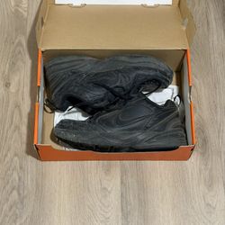 Nike Air Monarch black trainers 