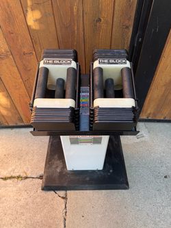 Powerblock adjustable dumbbells with stand in good working condition workout weights