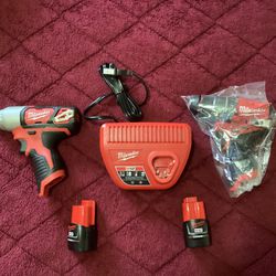 MILWAUKEE M12 Hammer Drill, Impact Driver, Charger And Two Batteries 