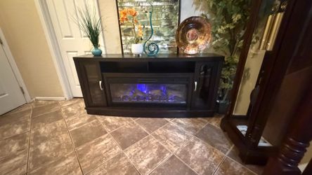Beautiful fireplace /tv stand with 5 colors of flames 70” inches long