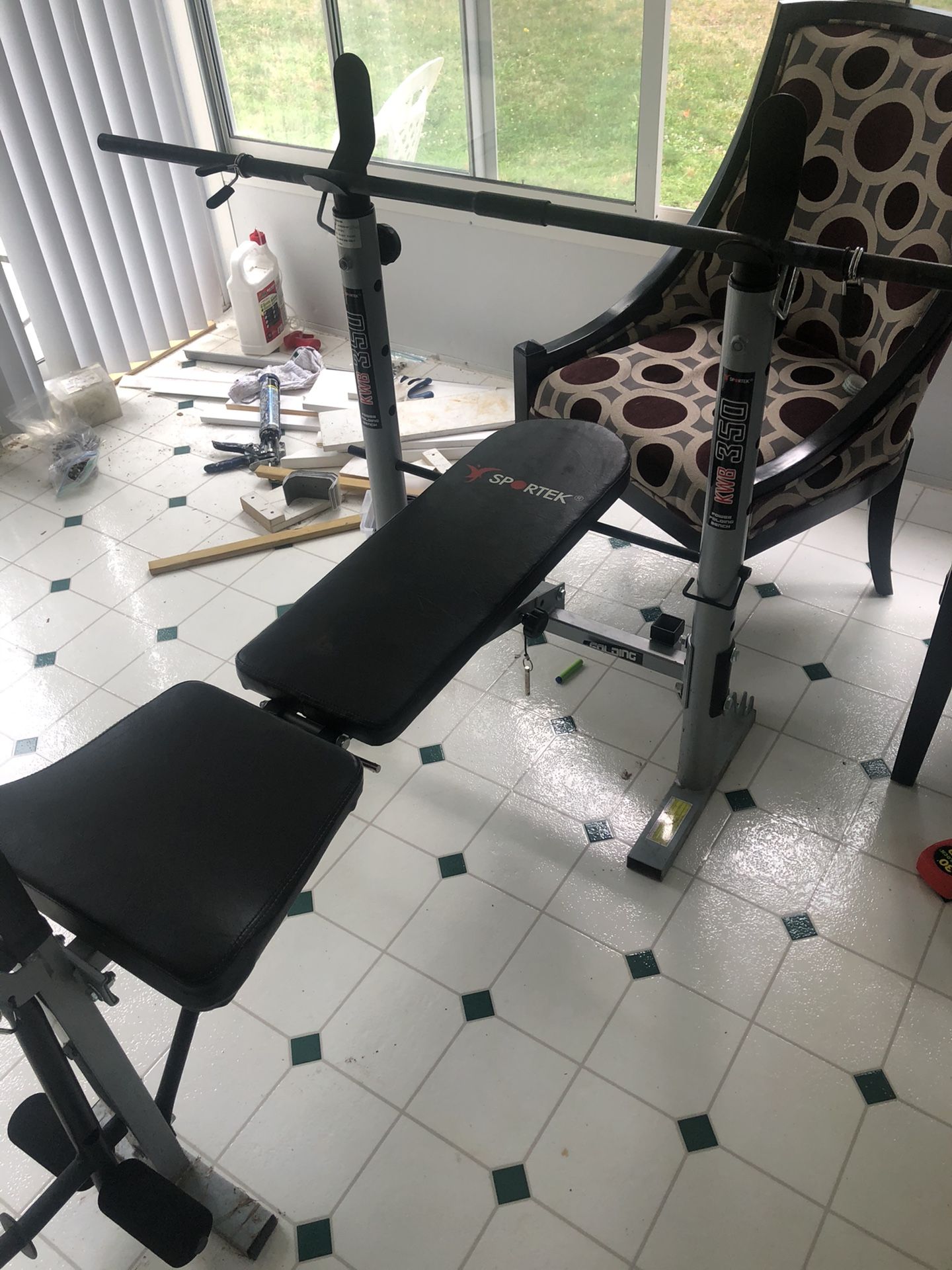 Adjustable Weight Bench and 100 pounds of weights with Barbell.