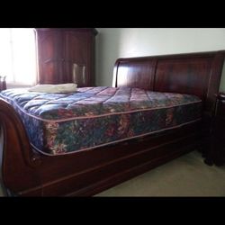 Beautiful  King Sleigh Bed, Dresser With Mirror, two End Tables and Huge Armoir Set