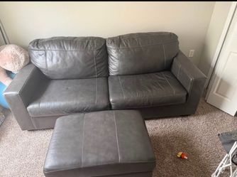 Ashley Brown Leather Couch and Ottomam