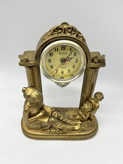 Vintage Eleco Quartz clock with women n Children