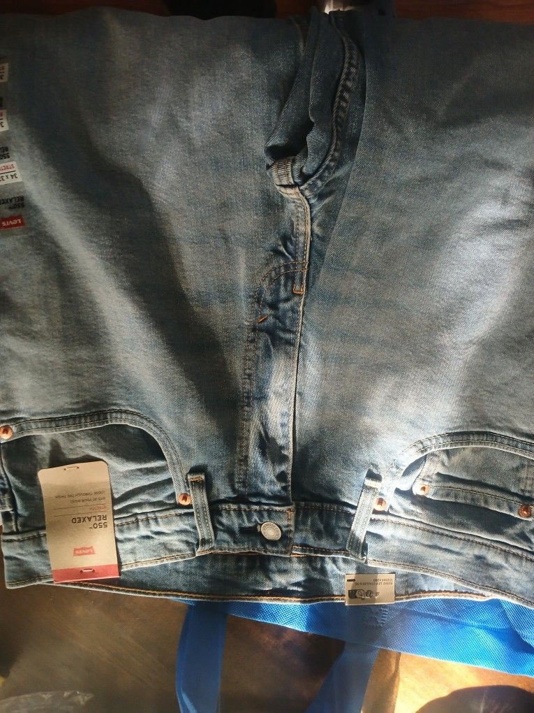 2 Pairs Of Brand New Levis 34x32, XL Ultra Performance Shorts also new.