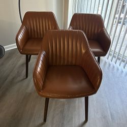 A Set Of Three Retro Brown Leather Vintage Chairs