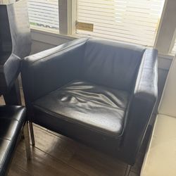 Two Black Leather Lounge Chairs