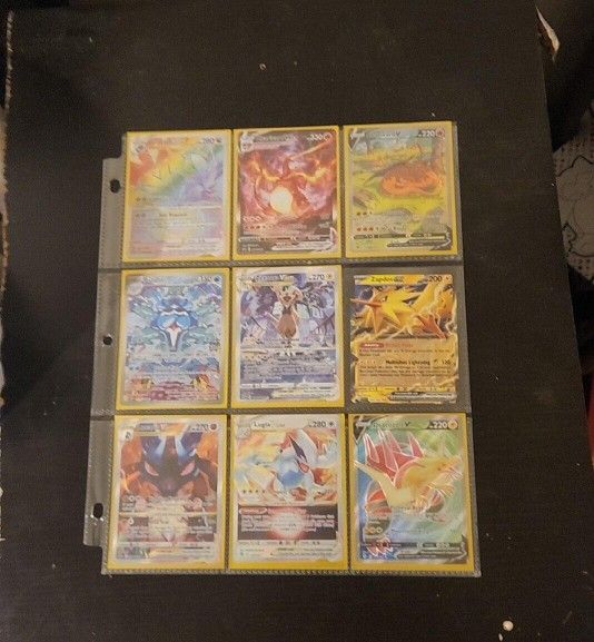 2 Pages Of Pokemon Cards. 9 In Each Page