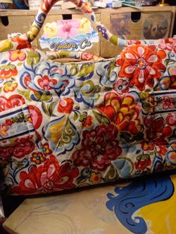 quilted fabric handbag by Vera Bradley in the retired Hope Garden pattern, specifically resembling the Gabby