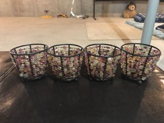 Four purple-and-brown candle holder