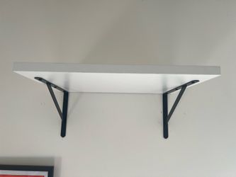 Two wall shelves with brackets