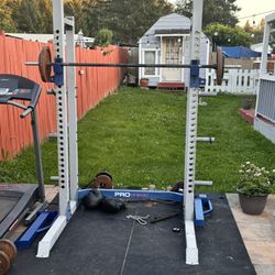 Squat Rack With Some Weights 