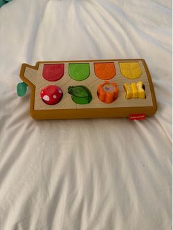 Fisher-Price Hide & Peek Pop-Up activity toy designed for sensory engagement