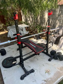 Adjustable bench press. With squat rack in the back