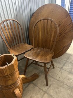 Sold oak petal 44 inch round table and four chairs sturdy excellent condition