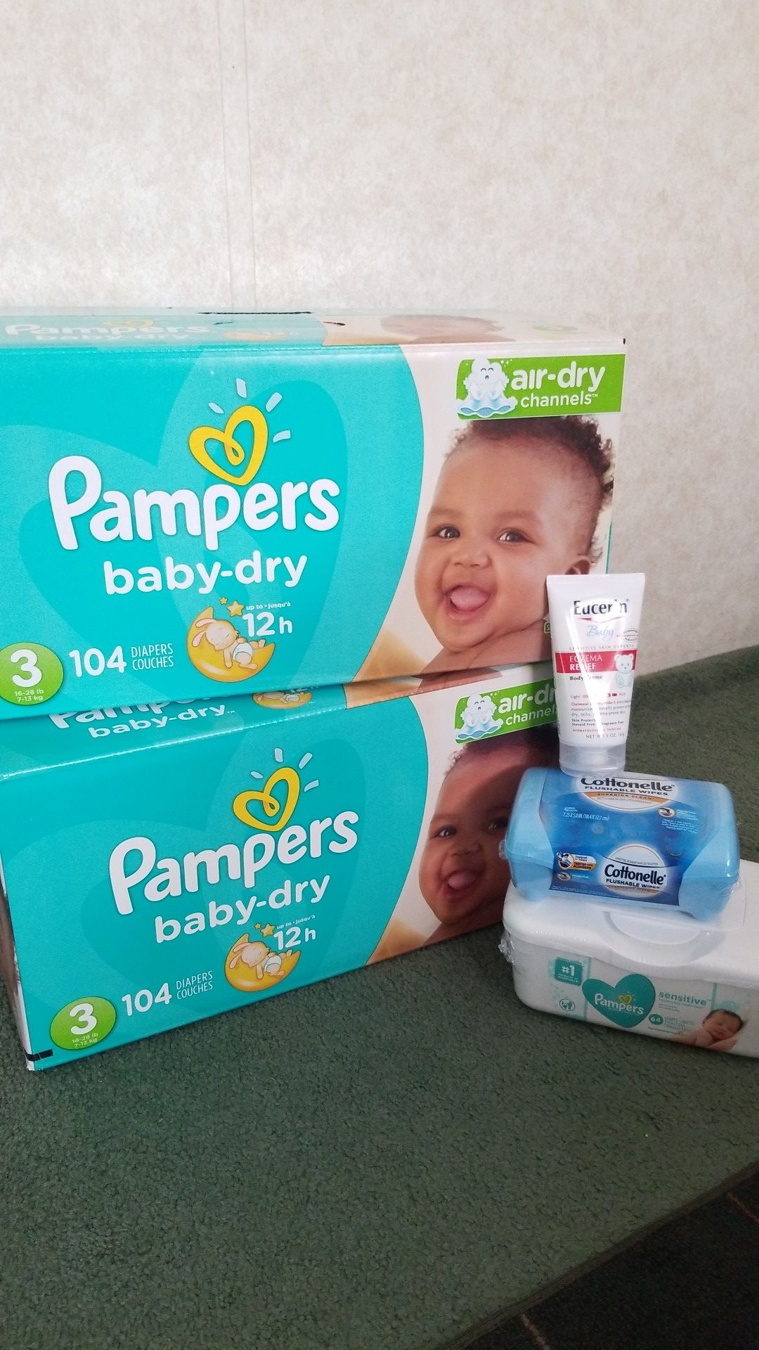 2 boxes of Pampers sz3 ,wipes and baby cream