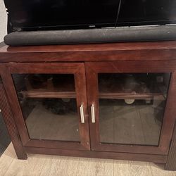 Gorgeous Entertainment Stand With Glass Doors. Sound Bar And Tv Included For Free If Wanted.
