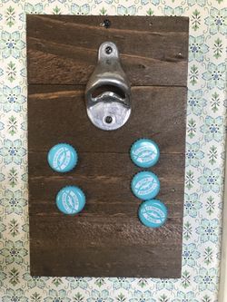 Awesome vintage bottle opener with magnetic wood backing.