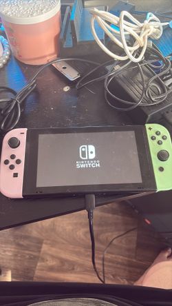 Nintendo switch one with SD card and docking station