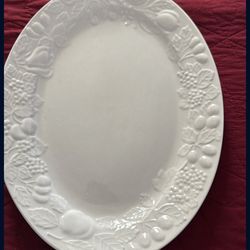Gibson Home Fruitful Oval Serving Platter, featuring an embossed fruit design around the rim.
