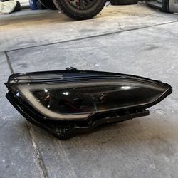 Tesla headlight passenger Side
