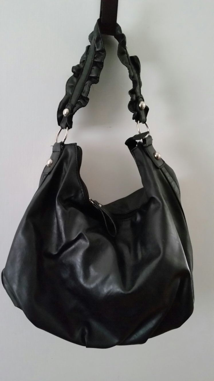 Black purse with ruffled strap
