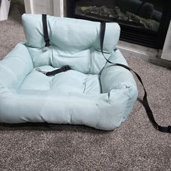 Dog Car Seat Cushion Car seat cushion for dogs. Very clean. Used 3 times. Like new. No stains. Puppy out grew it. Easy to attach to car seat. Loved it